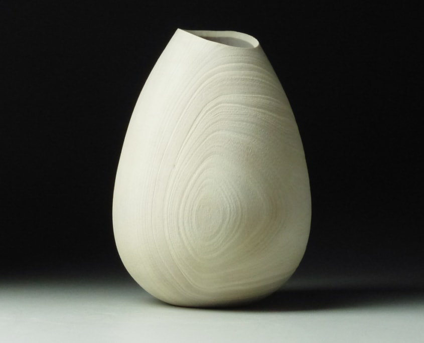 Madrone Vessel - 5 1/2”h x 3 3/4”w Turned, hollowed, sandblasted, carved rim and bleached.