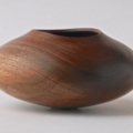 Black Walnut Vessel - 5 1/2”w x 2 3/4”h Turned, hollowed and carved rim.