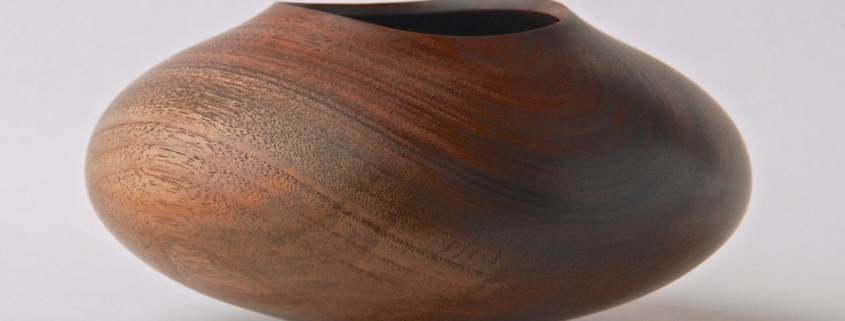 Black Walnut Vessel - 5 1/2”w x 2 3/4”h Turned, hollowed and carved rim.